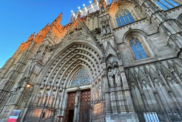 Gothic church, tall arches inset with lots of sculptures of saints.